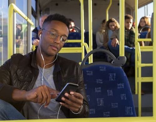 Man listening to music on bus